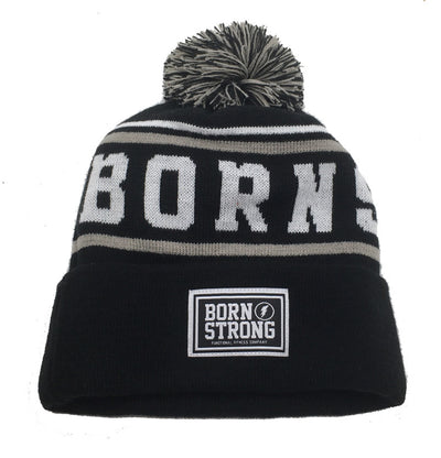 BORN STRONG hoed met pompon - LIMITED EDITION